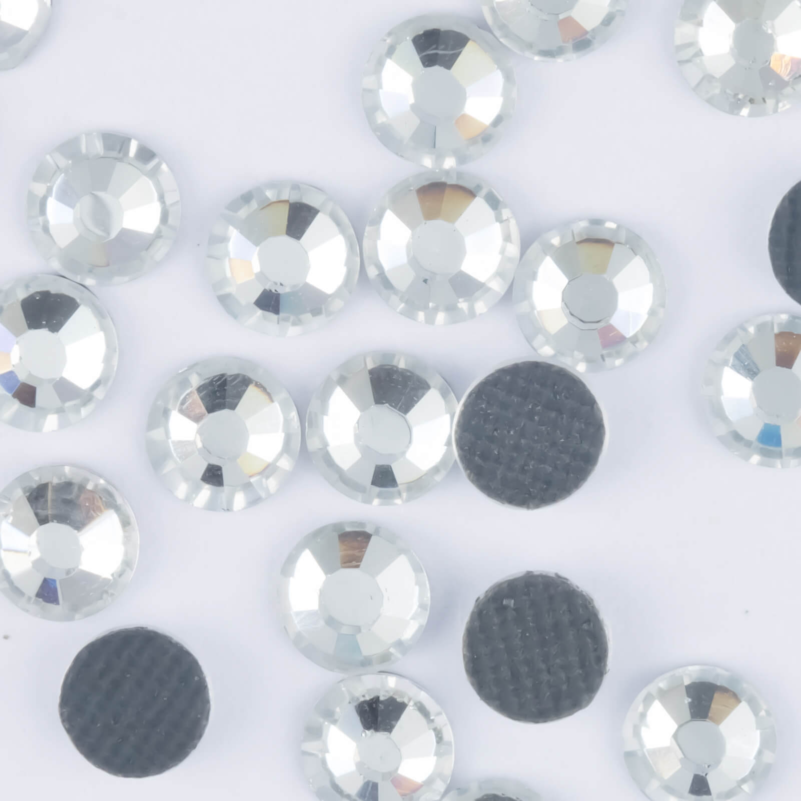 What surfaces can Hotfix rhinestones be applied onto? – Worthofbest